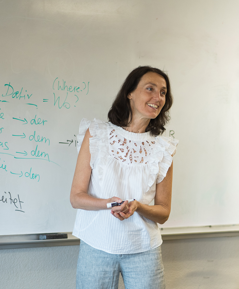 Intermediate Adult class teacher teaching grammar.