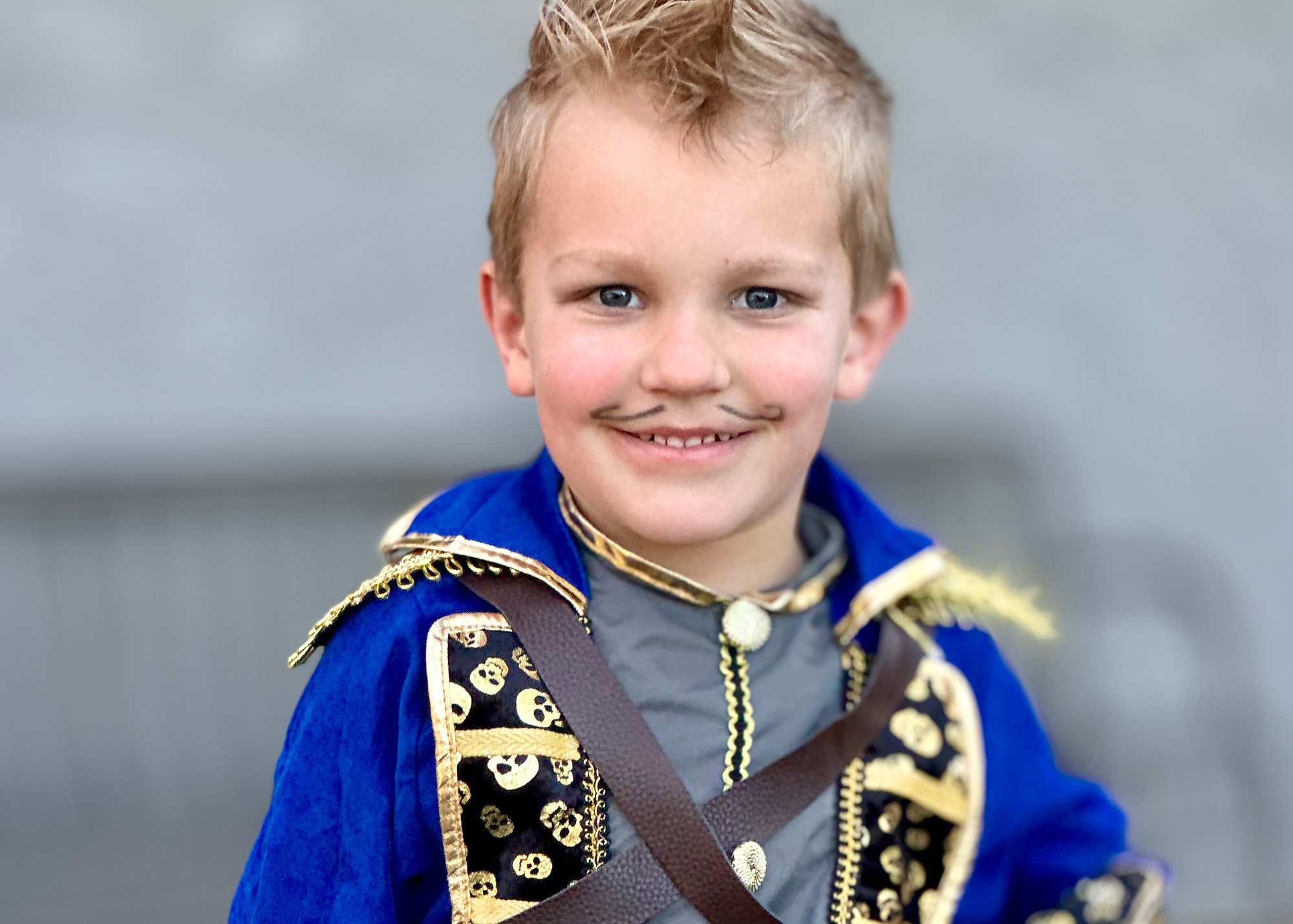 An early elementary student dressed in a knight costume.