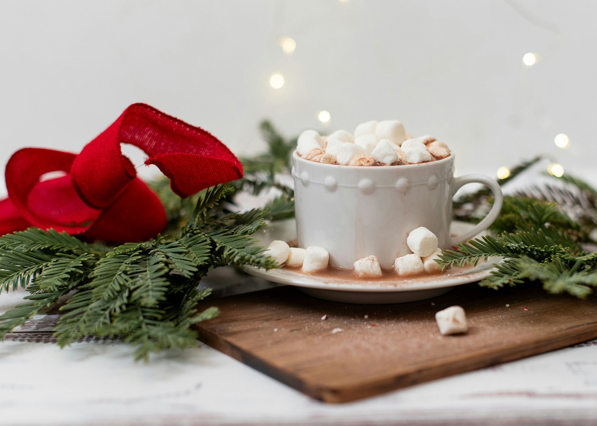 A cup of hot cocoa with marshmallows.