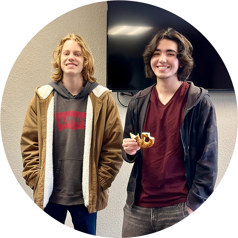 School-Pause-3 Two high school students eating pretzels at break time
