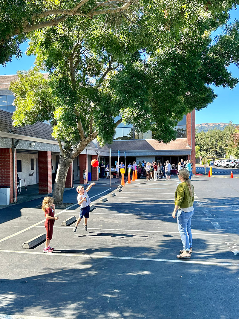 Elementary students playing ball at break time.